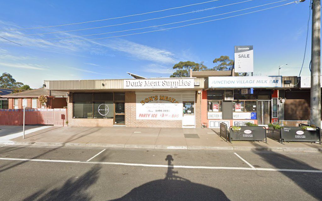 Don's Meat Supplies storefront in a suburban strip with brick facade and hand-painted signage under blue sky